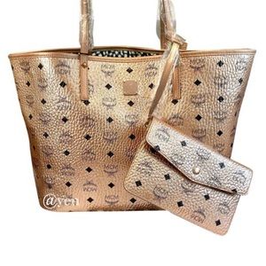 Medium logo Metalic coated canvas tote….. used carried a few times no scratches